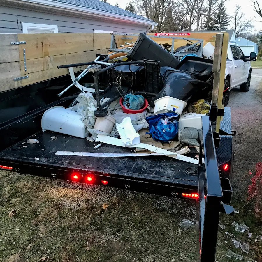 Roll-off dumpster delivered to a residential driveway in Benton Harbor