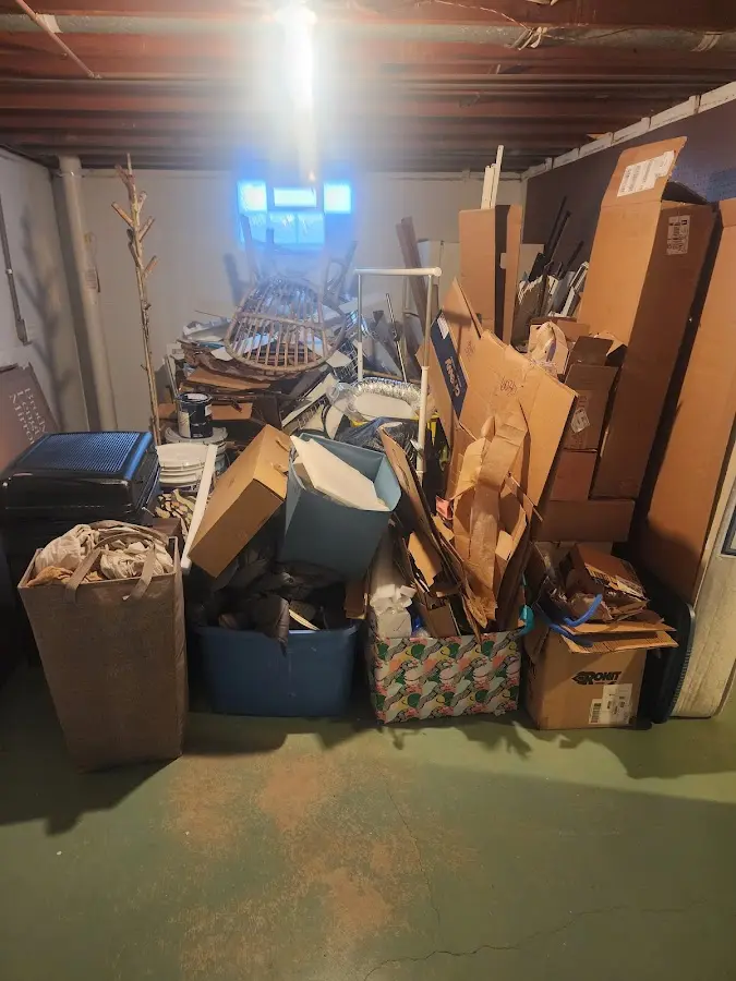 Roll-off dumpster container at job site for 2 Yard Dumpster Rental in Benton Harbor